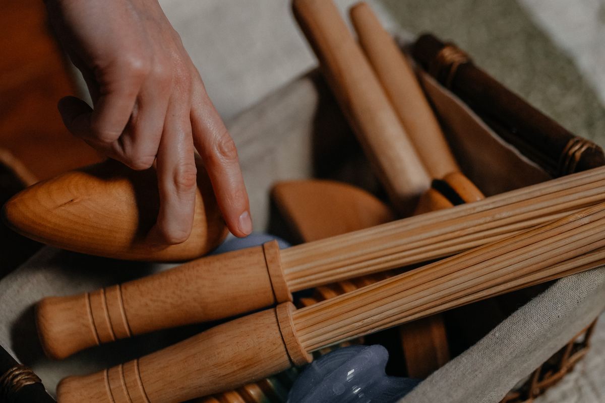 A basket of wooden rolling pins and drops used in Slavic bodywork